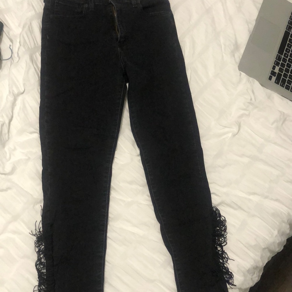 Black skinny jeans with fringe detailing